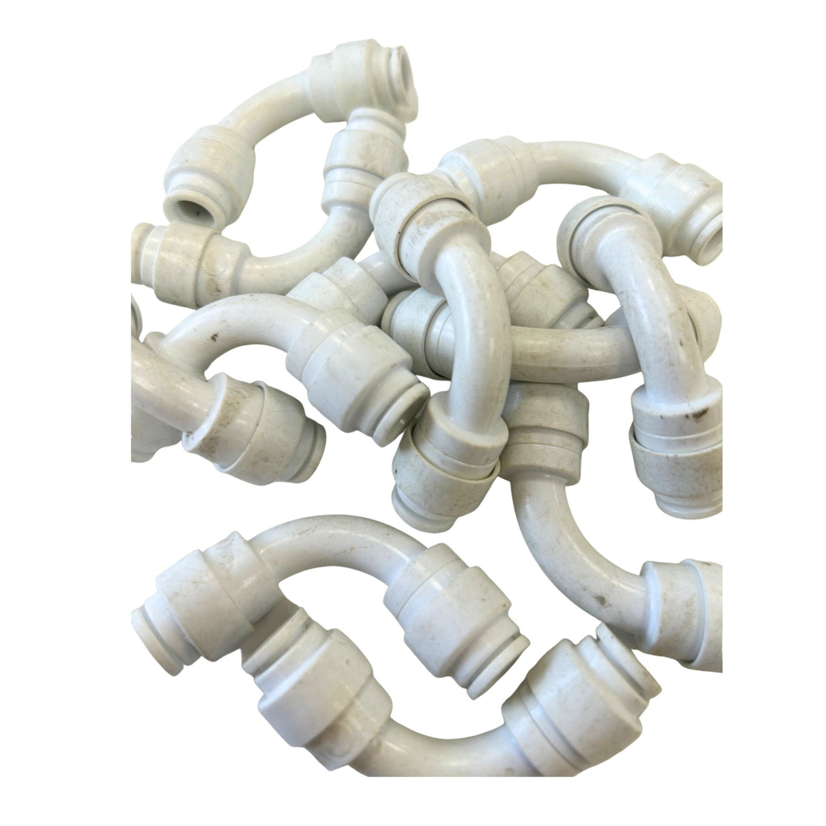 Pack of 12 white 5/16 inch push-fit flow elbows with surface marks